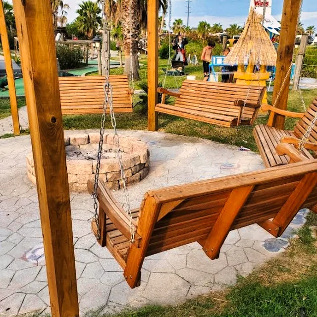 Fire pit with wooden swings at the resort